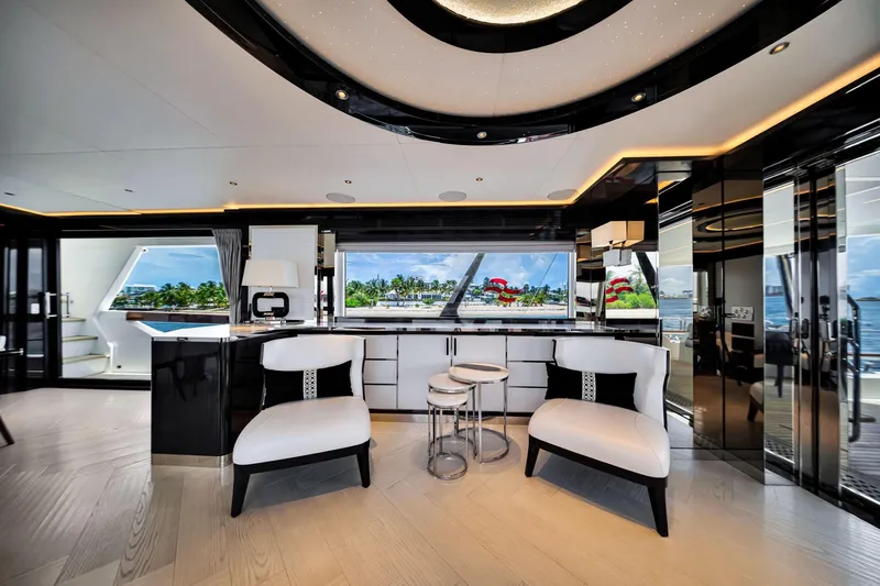  Yacht Photos Pics Luxurious interior of 2021 Sirena 88 yacht with modern seating and panoramic windows.