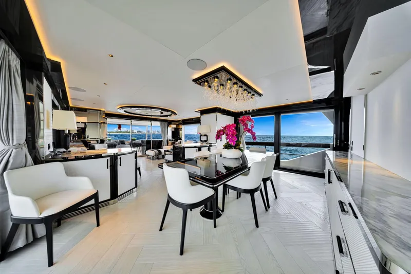  Yacht Photos Pics Luxurious interior of 2021 Sirena 88 yacht with ocean view and elegant dining area.