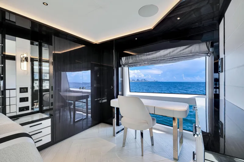  Yacht Photos Pics Luxurious interior of 2021 Sirena 88 yacht with ocean view through large window.