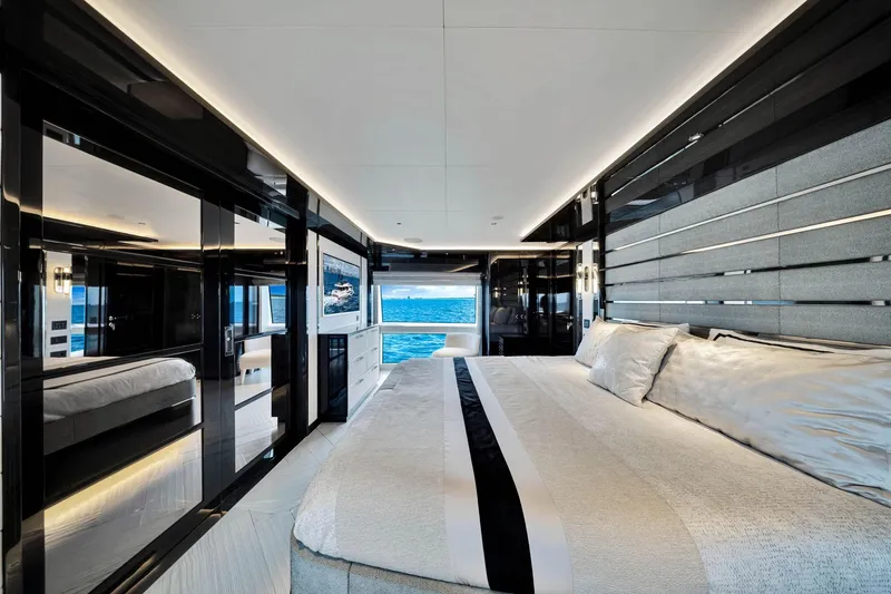 Yacht Photos Pics Luxurious bedroom interior of 2021 Sirena 88 yacht with ocean view.