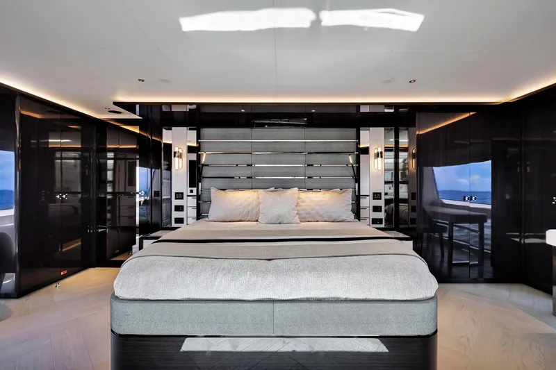  Yacht Photos Pics Luxurious bedroom interior of 2021 Sirena 88 yacht with modern design and elegant lighting.