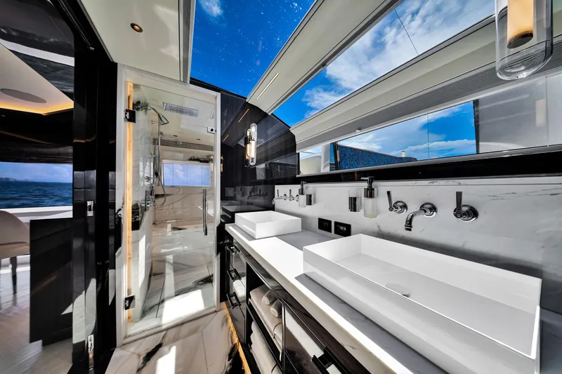  Yacht Photos Pics Luxurious bathroom interior on 2021 Sirena 88 yacht with ocean view and modern fixtures.