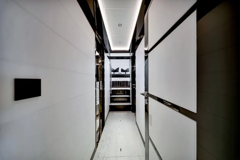  Yacht Photos Pics Luxurious interior hallway of 2021 Sirena 88 yacht, featuring modern design and sleek finishes.