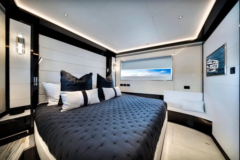  Yacht Photos Pics Luxurious bedroom interior of 2021 Sirena 88 yacht with modern design and ocean view.