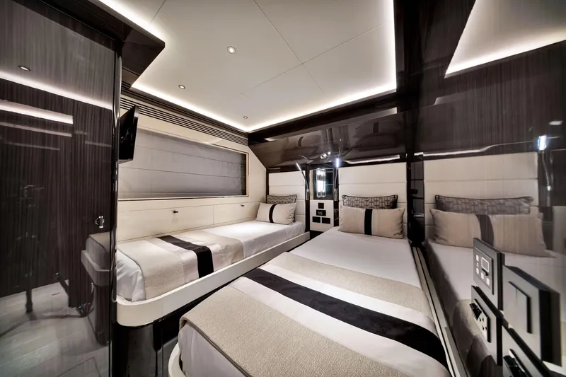  Yacht Photos Pics Luxurious interior of 2021 Sirena 88 yacht with modern twin beds and sleek design.