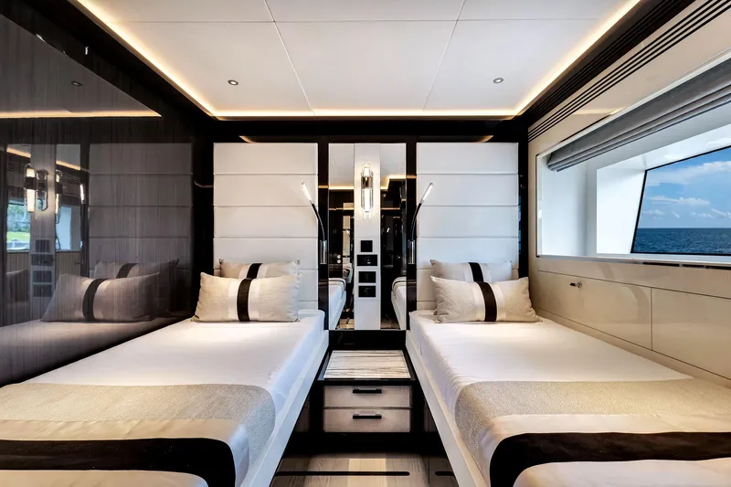  Yacht Photos Pics Luxurious Sirena 88 yacht interior, 2021 model, featuring twin beds and ocean view window.