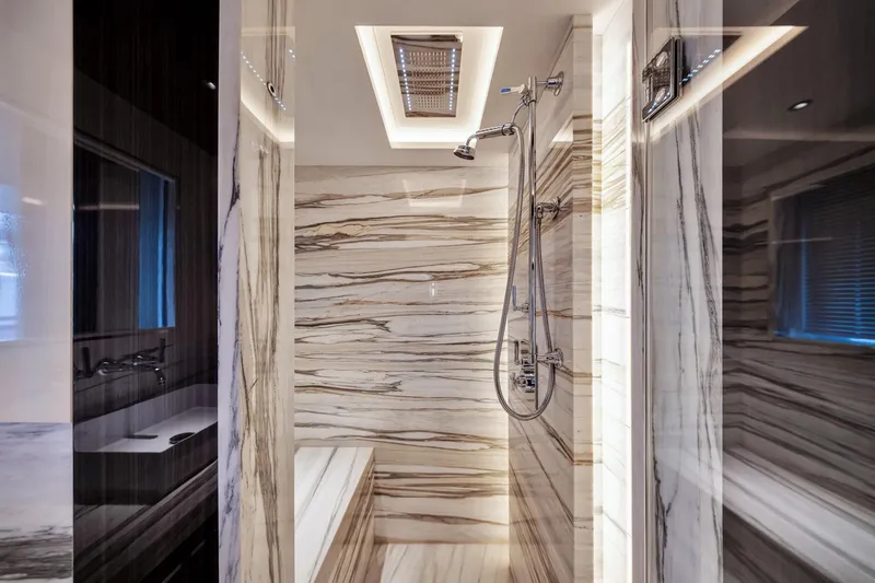  Yacht Photos Pics Luxurious marble bathroom interior on Sirena 88 yacht, 2021 model, featuring modern shower design.