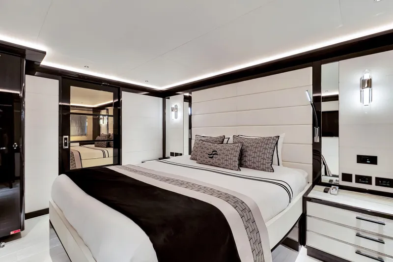  Yacht Photos Pics Luxurious bedroom interior on 2021 Sirena 88 yacht, featuring elegant design and modern lighting.