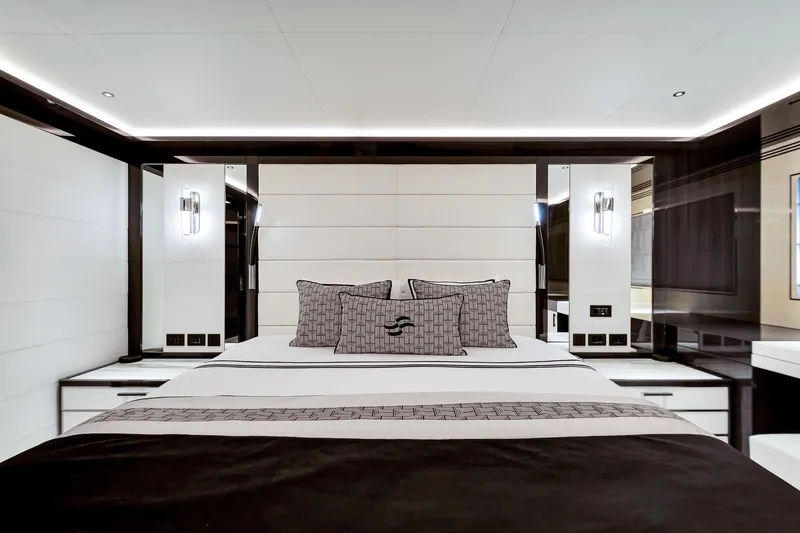 Yacht Photos Pics Luxurious bedroom interior on 2021 Sirena 88 yacht, featuring modern design and elegant lighting.