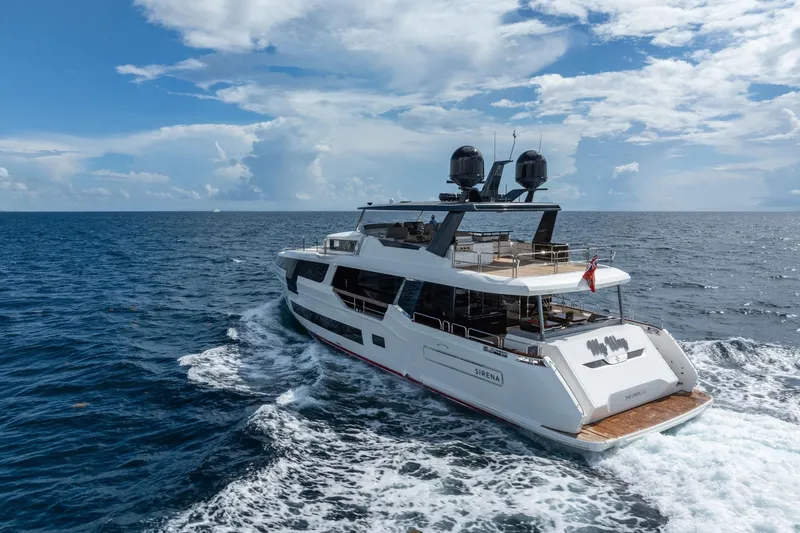  Yacht Photos Pics Luxury Sirena 88 yacht cruising on open sea, 2021 model, under a partly cloudy sky.