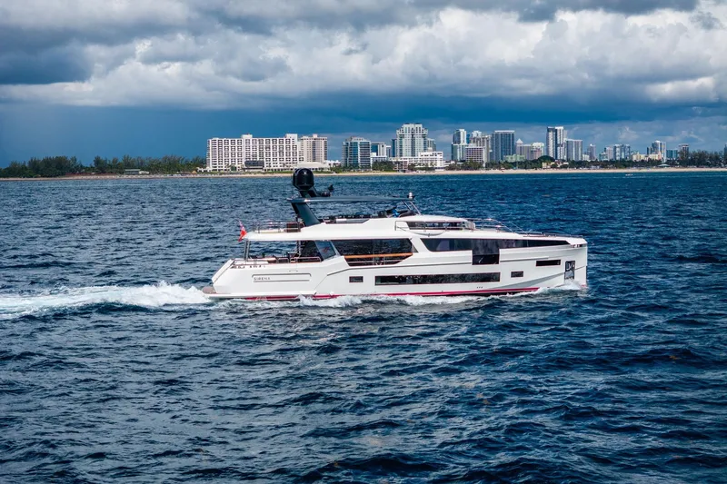  Yacht Photos Pics Luxury Sirena 88 yacht cruising near a city skyline, 2021 model.