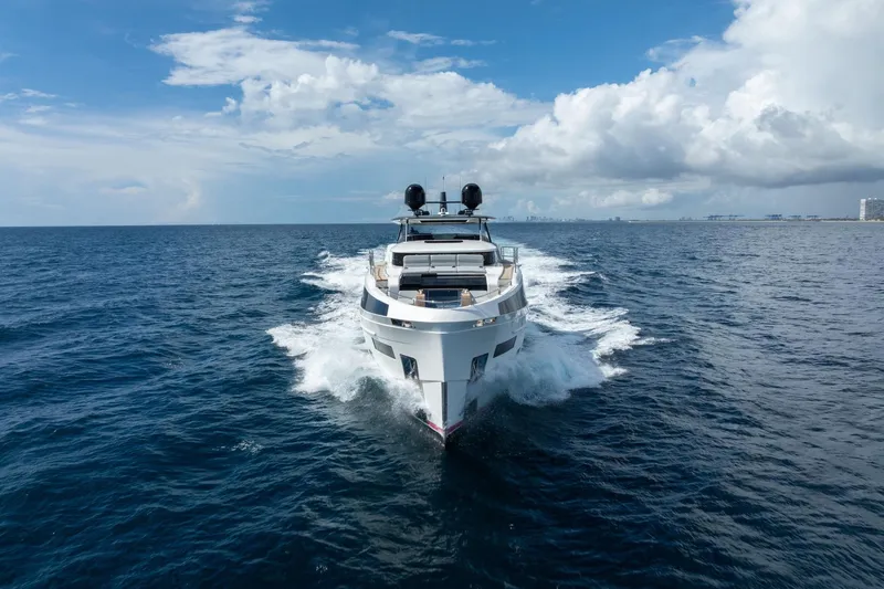  Yacht Photos Pics Luxury Sirena 88 yacht cruising on open sea under blue sky, 2021 model.