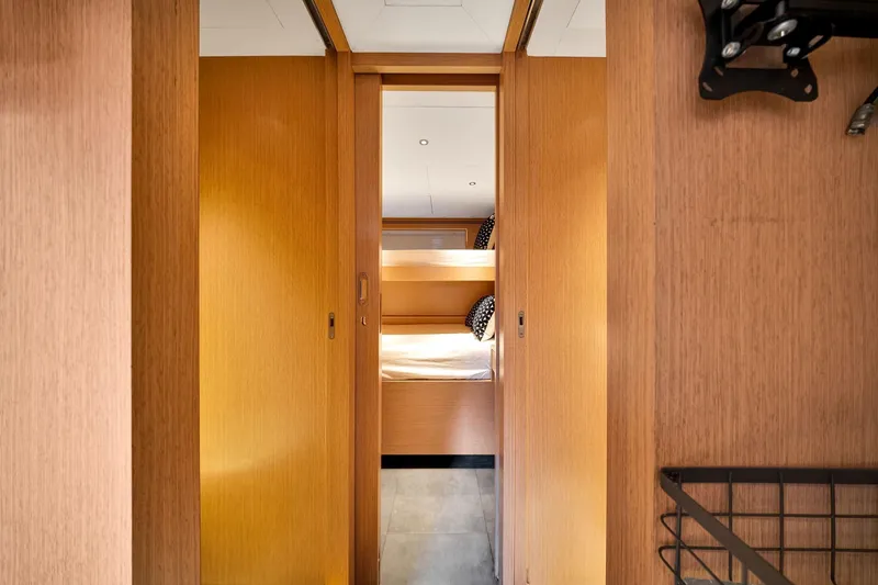  Yacht Photos Pics Interior of 2021 Sirena 88 yacht, featuring a cozy wooden cabin with bunk beds.