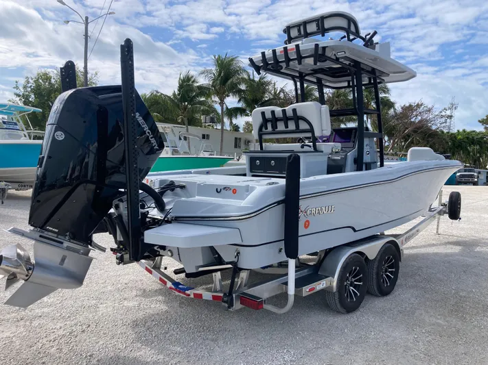  Yacht Photos Pics 2025 Crevalle 26HCO boat on trailer, featuring powerful outboard motor.
