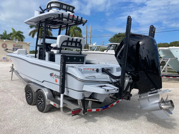  Yacht Photos Pics 2025 Crevalle 26HCO boat on trailer, featuring powerful outboard motor and sleek design.