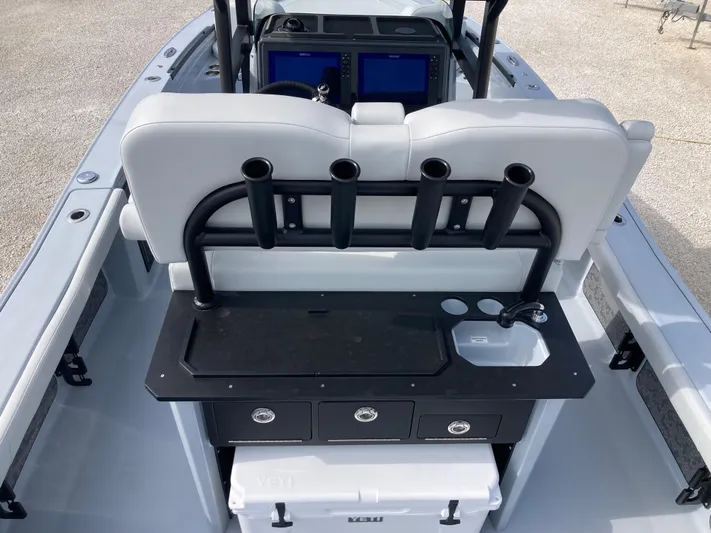  Yacht Photos Pics 2025 Crevalle 26HCO boat interior with rod holders, storage, and sink.