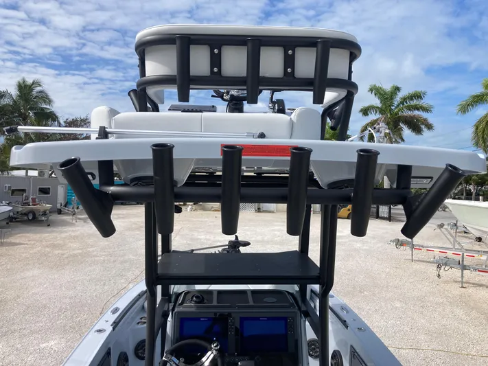  Yacht Photos Pics Crevalle 26HCO 2025 boat with rod holders and navigation equipment, parked outdoors.