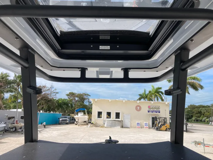  Yacht Photos Pics View from Crevalle 26HCO 2025 boat, showcasing T-top and marina background.