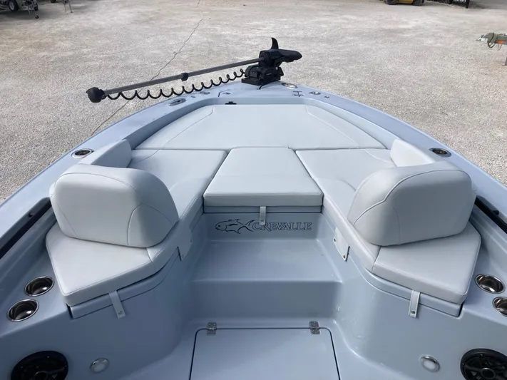  Yacht Photos Pics 2025 Crevalle 26HCO boat interior with cushioned seating and trolling motor.