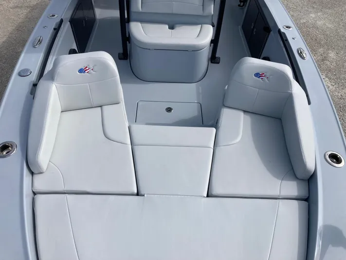  Yacht Photos Pics 2025 Crevalle 26HCO boat interior with white cushioned seating.