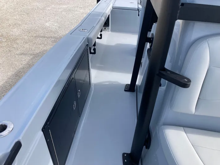  Yacht Photos Pics 2025 Crevalle 26HCO boat interior with seating and storage compartments.