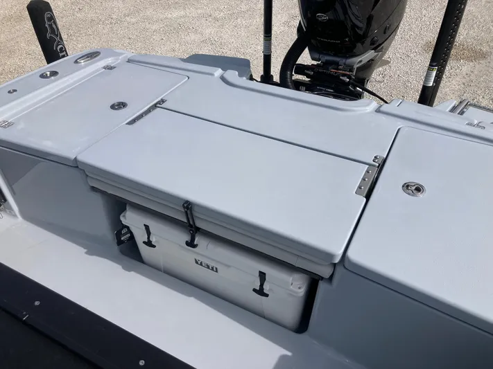  Yacht Photos Pics Crevalle 26HCO 2025 boat deck with storage compartments and motor.