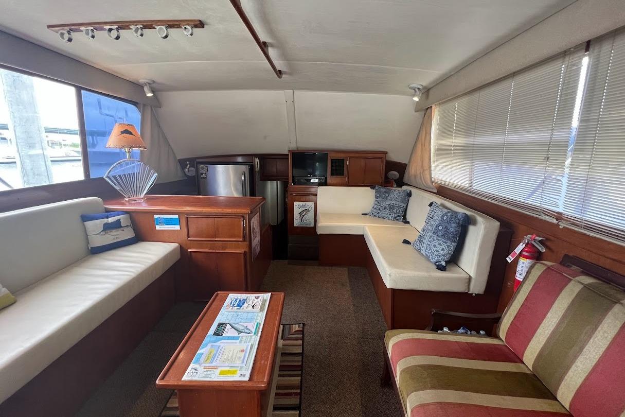 Luxurious 1988 Post 46 ll yacht interior with cozy seating and elegant decor.