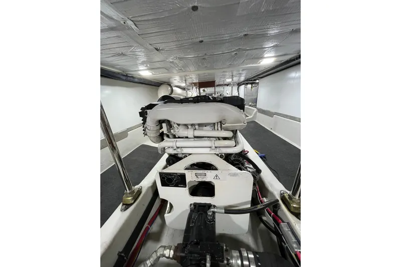 Pacific Rose Yacht Photos Pics Engine room of 2009 American Tug 49 Limited, showcasing mechanical components and insulation.