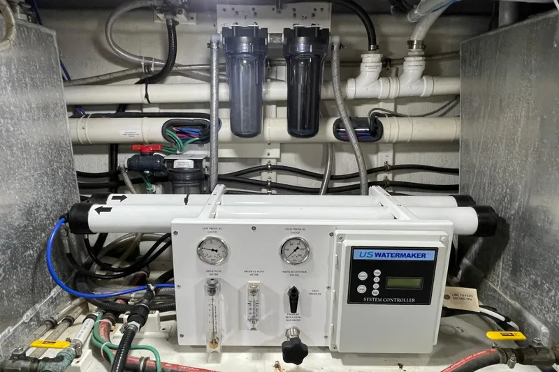 Pacific Rose Yacht Photos Pics Engine room of 2009 American Tug 49 Limited with US Watermaker system.