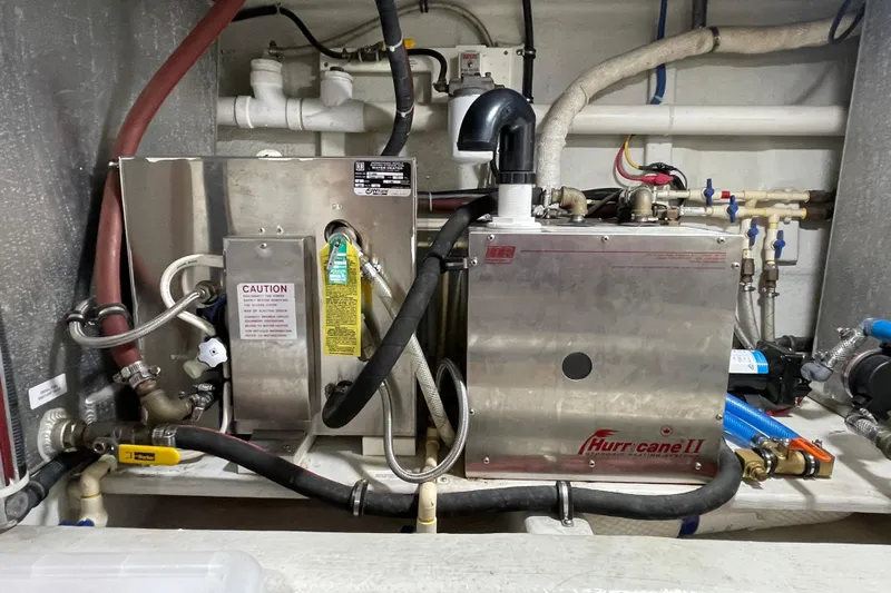 Pacific Rose Yacht Photos Pics Engine room of 2009 American Tug 49 Limited with Hurricane II heating system.