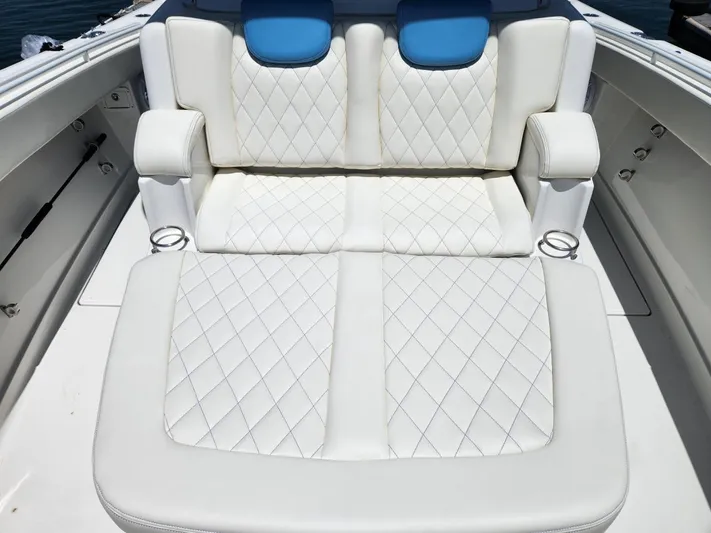 Triple J Yacht Photos Pics Luxurious white seating on 2018 HCB 39 Speciale boat with quilted design.