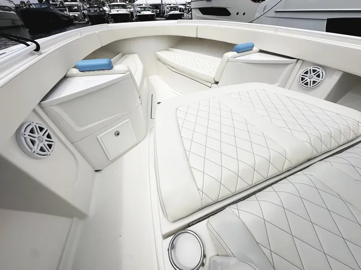 Triple J Yacht Photos Pics Luxurious interior of 2018 HCB 39 Speciale boat with white quilted seating.