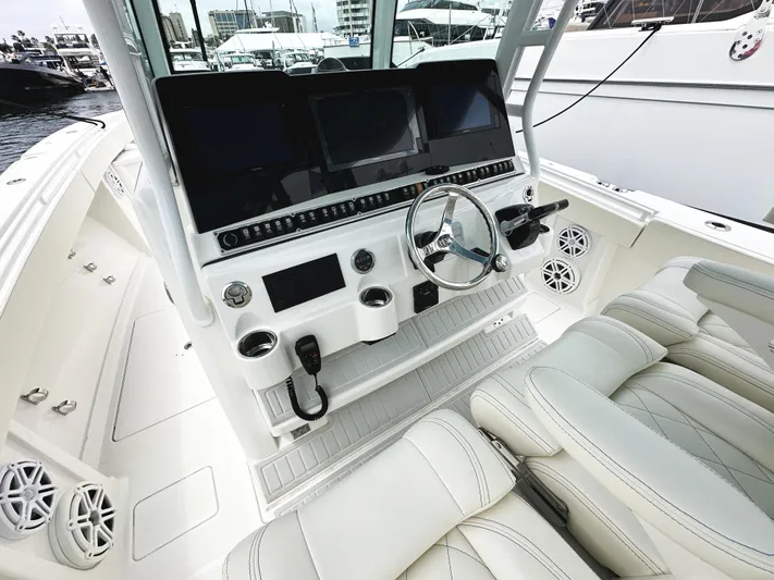 Triple J Yacht Photos Pics 2018 HCB 39 Speciale boat cockpit with modern controls and luxurious seating.