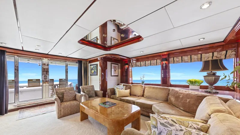 Destiny Yacht Photos Pics Luxurious yacht interior with ocean view, featuring plush seating and elegant decor, Destiny 98', 2001.