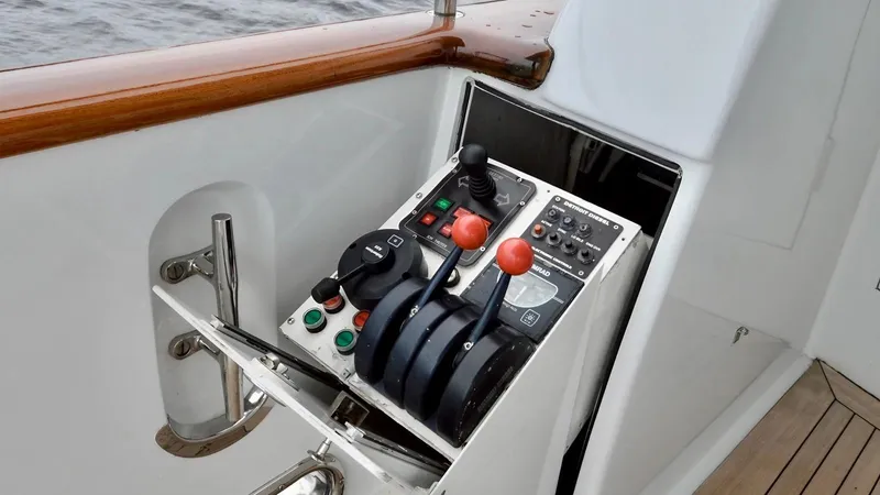 Destiny Yacht Photos Pics Control panel of a 2001 Destiny 98' yacht with levers and buttons.
