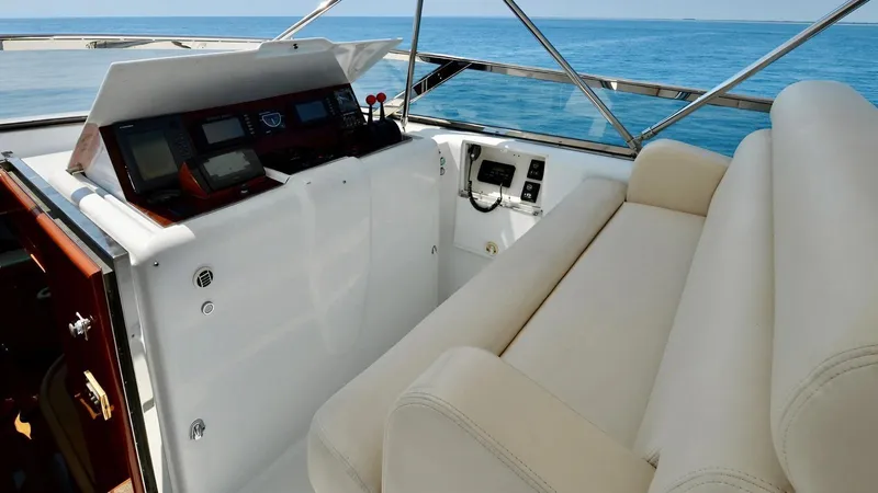 Destiny Yacht Photos Pics Luxury yacht cockpit with beige seating, advanced navigation controls, and ocean view. Destiny 98', 2001 model.