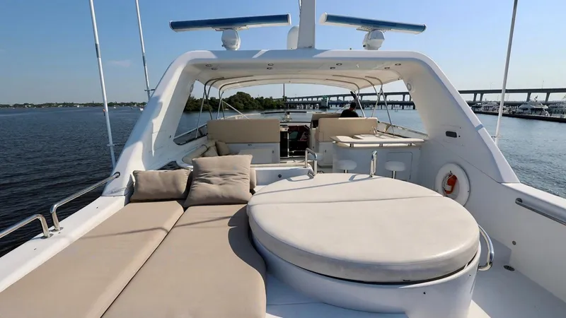 Destiny Yacht Photos Pics Luxurious 2001 Destiny 98' yacht with spacious deck and comfortable seating on a sunny day.