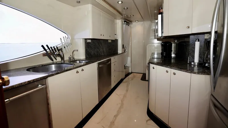 Destiny Yacht Photos Pics Luxurious yacht kitchen with modern appliances, granite countertops, and sleek cabinetry. Destiny 98', 2001 model.