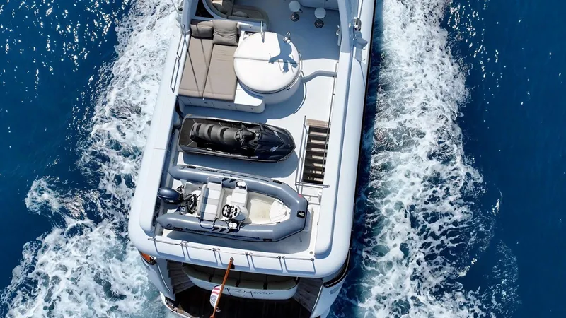 Destiny Yacht Photos Pics Aerial view of 2001 Destiny 98' yacht cruising on blue ocean waters.