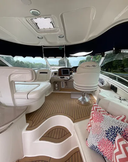 Decompressing Yacht Photos Pics Luxurious 2005 Sea Ray 500 Sundancer yacht interior with plush seating and modern dashboard.