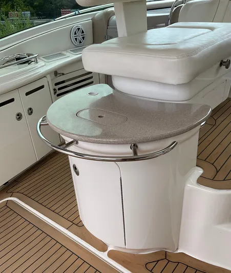 Decompressing Yacht Photos Pics Luxury seating area on 2005 Sea Ray 500 Sundancer yacht with sleek design and wood flooring.