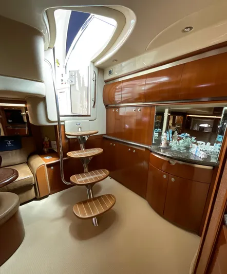 Decompressing Yacht Photos Pics Luxurious interior of 2005 Sea Ray 500 Sundancer yacht with elegant wooden cabinetry.