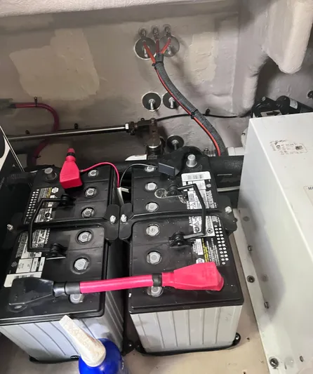 Decompressing Yacht Photos Pics Batteries in a 2005 Sea Ray 500 Sundancer engine compartment, showing wiring and connections.