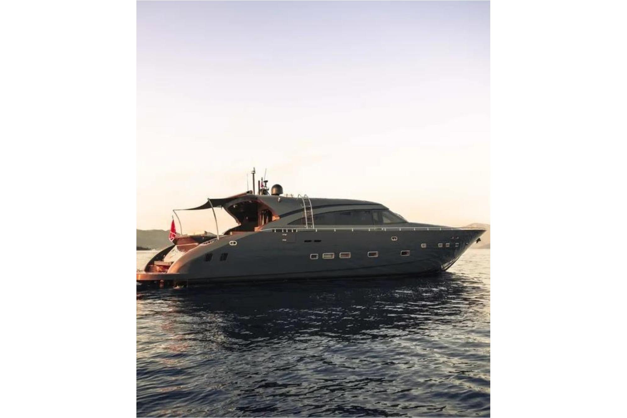 Luxurious 2006 AB 92 yacht cruising on calm waters at sunset.