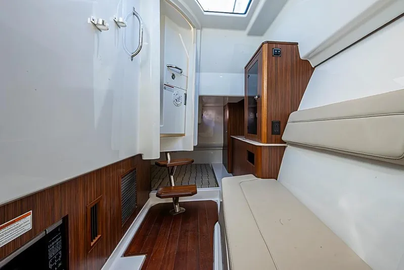 Yacht Photos Pics Interior of 2020 Pursuit DC 365 Dual Console boat with wood accents and seating.