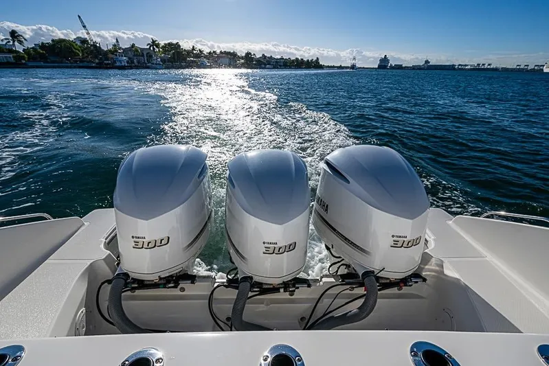  Yacht Photos Pics 2020 Pursuit DC 365 Dual Console with triple Yamaha 300 engines on open water.