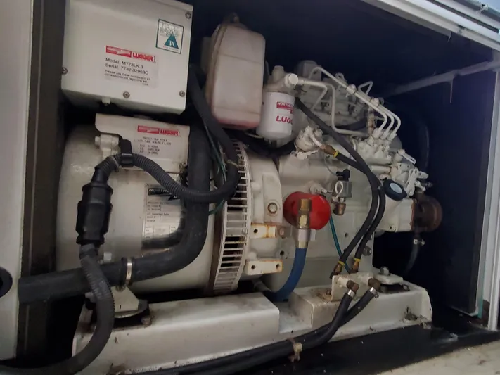 My Three Girls Yacht Photos Pics Engine compartment of a 2004 Lagoon 43 PC boat, showcasing mechanical components.