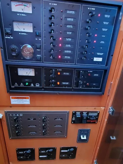 My Three Girls Yacht Photos Pics Control panel of a 2004 Lagoon 43 PC boat with various switches and indicators.