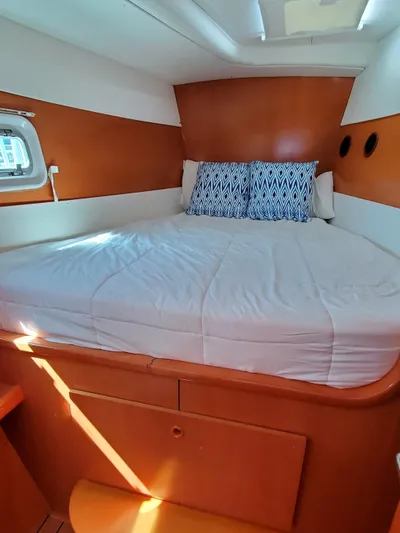 My Three Girls Yacht Photos Pics Cozy cabin interior of 2004 Lagoon 43 PC yacht with comfortable bedding.