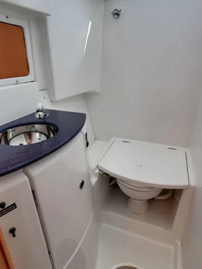 My Three Girls Yacht Photos Pics 2004 Lagoon 43 PC yacht bathroom with sink and toilet.